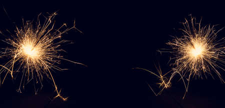 Christmas sparklers on a dark background. Copy of space. Holidays.の写真素材
