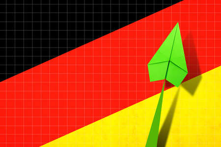 Upward arrow on the background of the flag of Germany. Paper plane. Economic recovery. Copy space....
