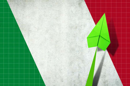 Upward arrow on the background of the flag of Italy. Paper plane. Economic recovery. Copy space. Business. Background.の写真素材