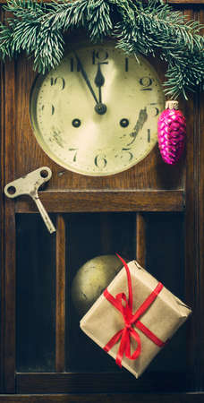 New Year composition with old wall clock and decorations, gifts and pine branchの写真素材