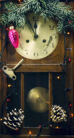 New Year composition with old wall clock and decorations, gifts and pine branchの写真素材