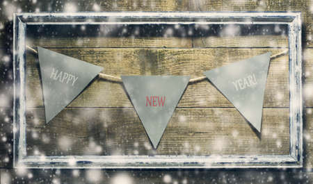 New Year composition with decorations old frame on a wooden backgroundの写真素材