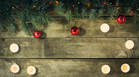 Christmas New year composition with candles on the old wooden background.Top viewの写真素材