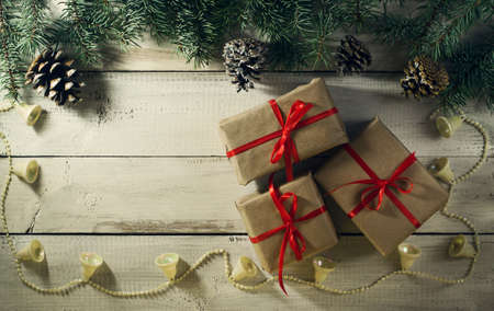 Christmas New year composition with gifts on the old wooden background. Top view with copy spaceの写真素材