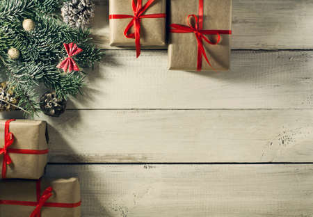 Christmas New year composition with gifts on the old wooden background. Top view with copy spaceの写真素材
