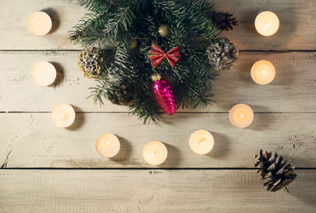 Christmas New year composition with candles on the old wooden background.Top viewの写真素材