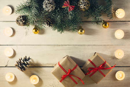 Christmas New year composition with candles on the old wooden background. Top view with copy spaceの写真素材