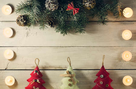 Christmas New year composition with candles on the old wooden background. Top view with copy spaceの写真素材
