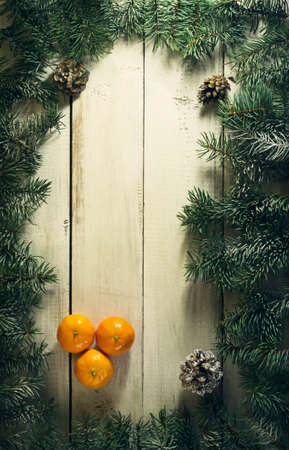 Christmas New year composition with tangerines on the old wooden background.Top viewの写真素材
