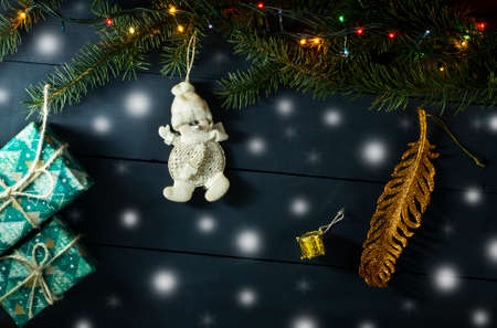 Christmas composition with Christmas tree branches, Christmas toys and gifts. On a blue wooden backgroundの写真素材