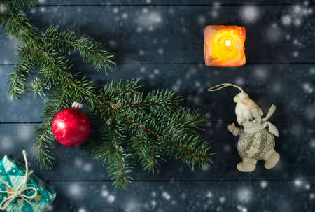 Christmas composition with Christmas tree branches, Christmas toys and gifts. On a blue wooden backgroundの写真素材