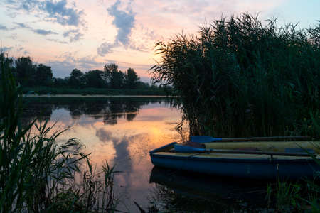Beautiful colorful sunrise over the river. Recreation. Travels. Tourism Fishingの写真素材