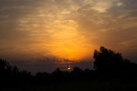 Beautiful sky with amazing clouds at sunrise. Summer morning