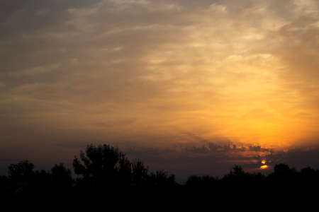 Beautiful sky with amazing clouds at sunrise. Summer morningの写真素材