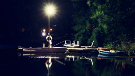Night view of the old pier for boats on the river. Travel. Tourism. Recreation.の写真素材
