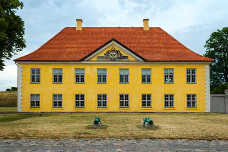 Copenhagen, Denmark - July 10, 2018. Fortress Castellet, Beautiful architecture. Yellow building with beautiful windows and a roof made of shingles. Architecture. Sights.のeditorial素材