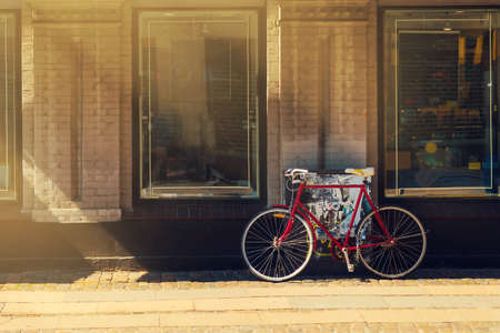 Bicycle parked near the store. Beautiful sunshine. Bicycle transportの写真素材