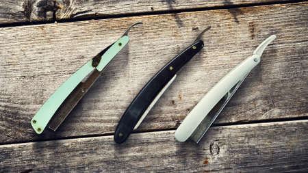 Concept Barber Shop. Old hairdresser razors on a wooden background. Copy space Beauty. Fashionの写真素材