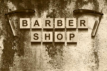 Barber concept. The inscription on the wooden cubes on a dark background. Beauty. Fashion. Background.の写真素材