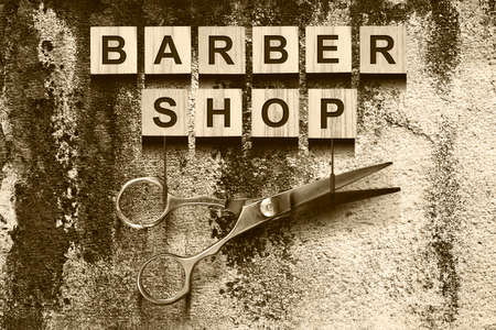 Concept Barber Shop. Inscription on wooden cubes dark background. Beauty. Fashionの写真素材