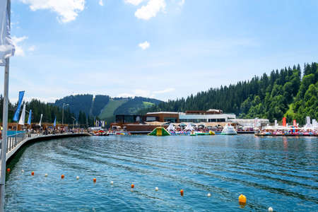 Bukovel. Ukraine. 17. July. 2021. Lake of Youth. Beautiful beach area Carpathians Summer Vacation Travelのeditorial素材