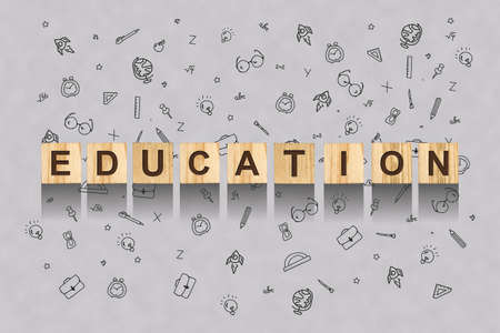 Education. Words on wooden blocks, on a gray background with drawn school supplies. Education concept. Background.の写真素材