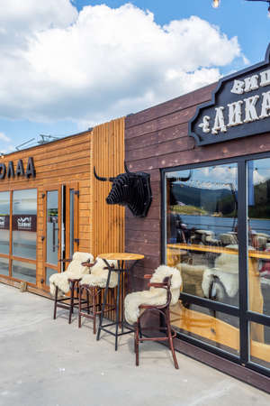 Bukovel. Ukraine. 17. July. 2021. Lake of Youth. A beautiful cafe on the beach of a mountain lake. Carpathians. Summer rest. Travelsのeditorial素材