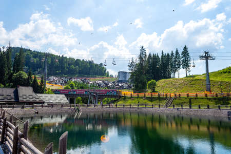 Bukovel. Ukraine. 17. July. 2021. Beautiful cottages and hotels in a ski resort. Carpathians. Summer rest travelsのeditorial素材