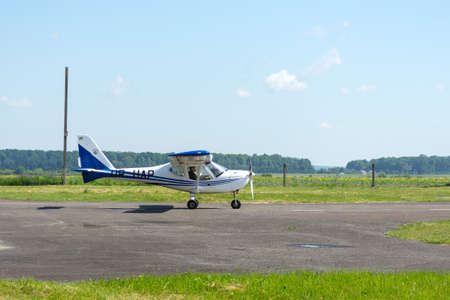 Gorodok. Ukraine. June 6, 2021. Tsuniv airfield. Training aircraft, taxiing to the runway. Sport Extreme entertainment Transport Relaxationのeditorial素材