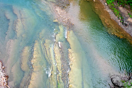 Beautiful mountain river. Aerial view. Close-up. Carpathians. Ukraine Nature Backgroundの写真素材