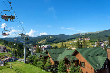 Bukovel. Ukraine. 9. August. 2020. Nice view, from the cable car, to the cottages and hotels at the foot of the mountain. Carpathians. Summer rest. Tourism. Travels.の写真素材