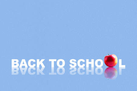 Back to school. Words on a blue background. Apple. Reflection. Copy space. School background. Education background. Background.の写真素材