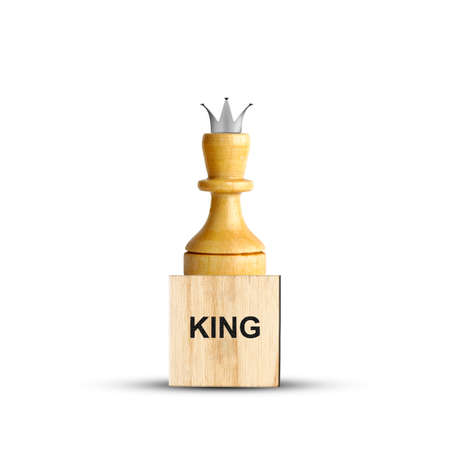 White Chess King, on a wooden block. Isolated on a white background. The game. Training. Education. Design element.の写真素材