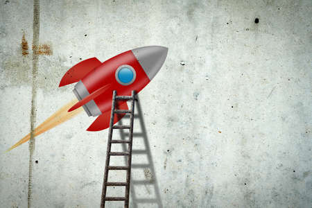 Space rocket on a concrete wall. Ladder to her. Concept of a new project. Business.の写真素材