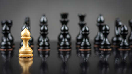 White pawn, in front of black, on a chessboard. Selective focus. Correct move. Strategy. Sport....
