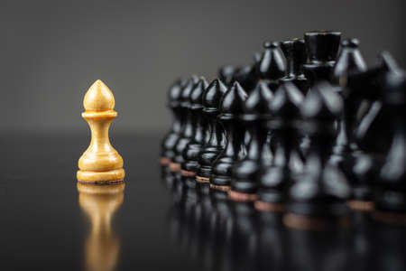 White pawn, in front of black, on a chessboard. Selective focus. Correct move. Strategy. Sport. Business Backgroundの写真素材