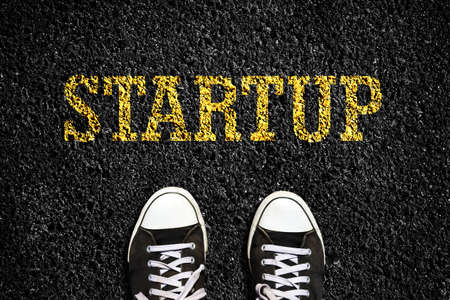 Start Up, word on the asphalt road. Sneakers. View from above. Launching a new project, business. Business. Lifestyle Backgroundの写真素材