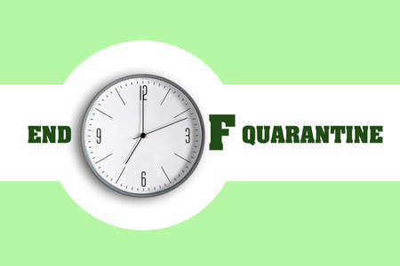 End of Quarantine. The inscription on a green background, with a clock. The end of the pandemic.の写真素材