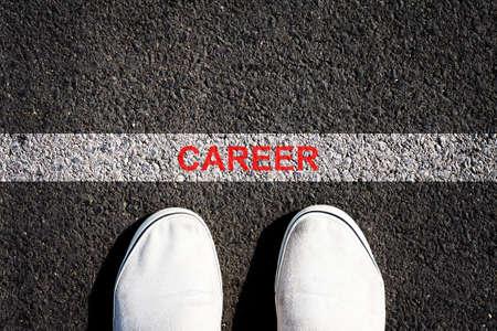 Career. The inscription on a white line on the asphalt. Sneakers. View from above. Copy space. Business. Career.の写真素材