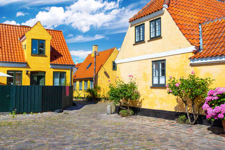 Small streets with beautiful, yellow old houses. Traditional Scandinavian houses Dragon, Denmark....