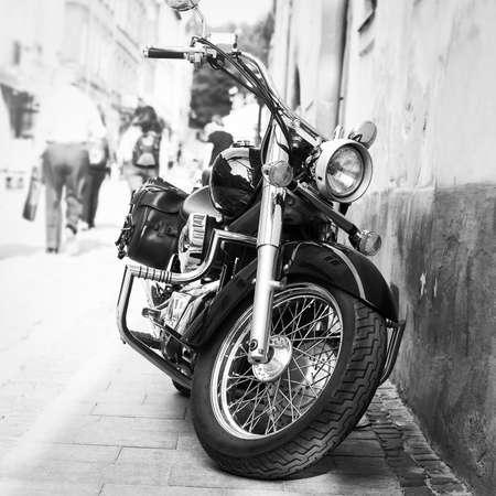 Beautiful motorcycle near the wall. Black and white photo. TronSport. Motorcycles.の写真素材