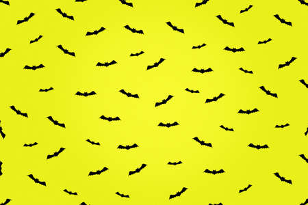 Happy Halloween background. A lot of bats icons on a yellow background. Festive background....
