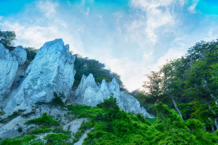 Beautiful white rocks on a background of blue cloudy sky. Mountain landscape. Nature.の写真素材