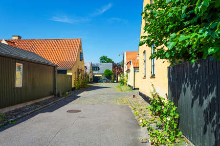 Small streets with beautiful, yellow old houses. Traditional Scandinavian houses Dragon, Denmark....