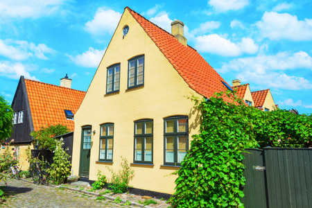 Small streets with beautiful, yellow old houses. Traditional Scandinavian houses Dragon, Denmark. Architecture Attractionsの写真素材