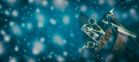 Hairdressing tool bag with tools against dark background. Copy space. Happy New Year and Merry...