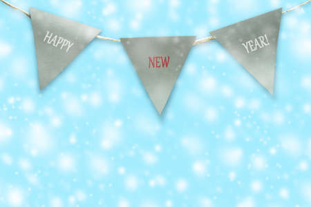 Triangular flags on a rope. Blue background. Christmas background. Congratulatory background.の写真素材