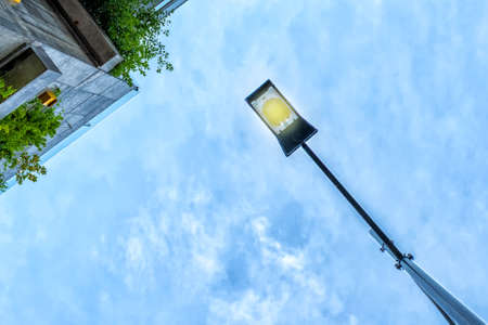 Street lamp against the blue sky. Bottom View Architecture. Detailsの写真素材