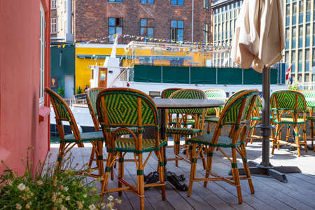 Outdoor cafe with wicker furniture. Copenhagen. Denmark.Architecture Detailsのeditorial素材