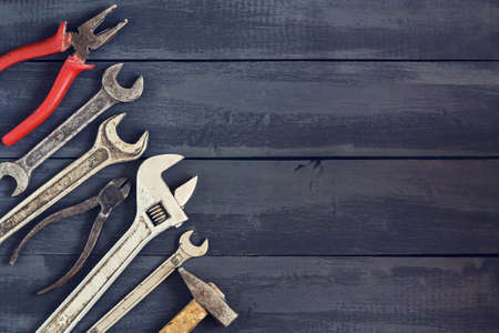 Variety of tools for wrenches on a dark wooden table. Copy space. Concept Happy Father's Day....